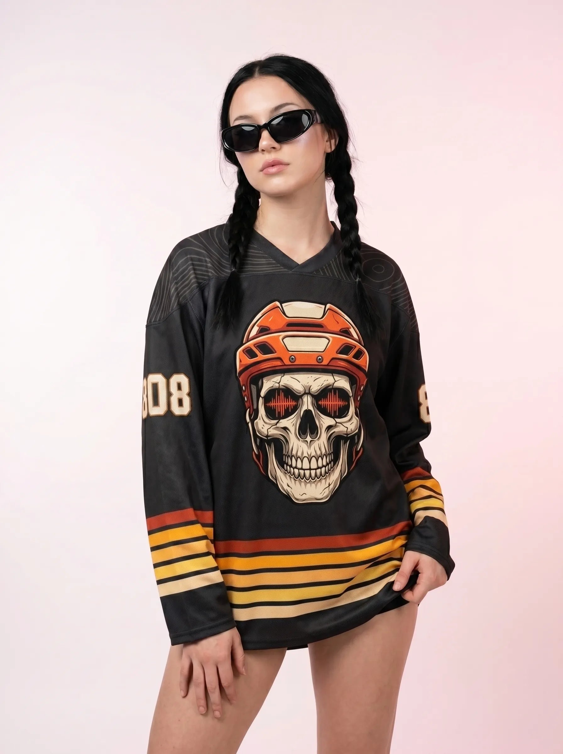 Female model wearing an oversized Basshead Rave Hockey Jersey with sunglasses for a festival look