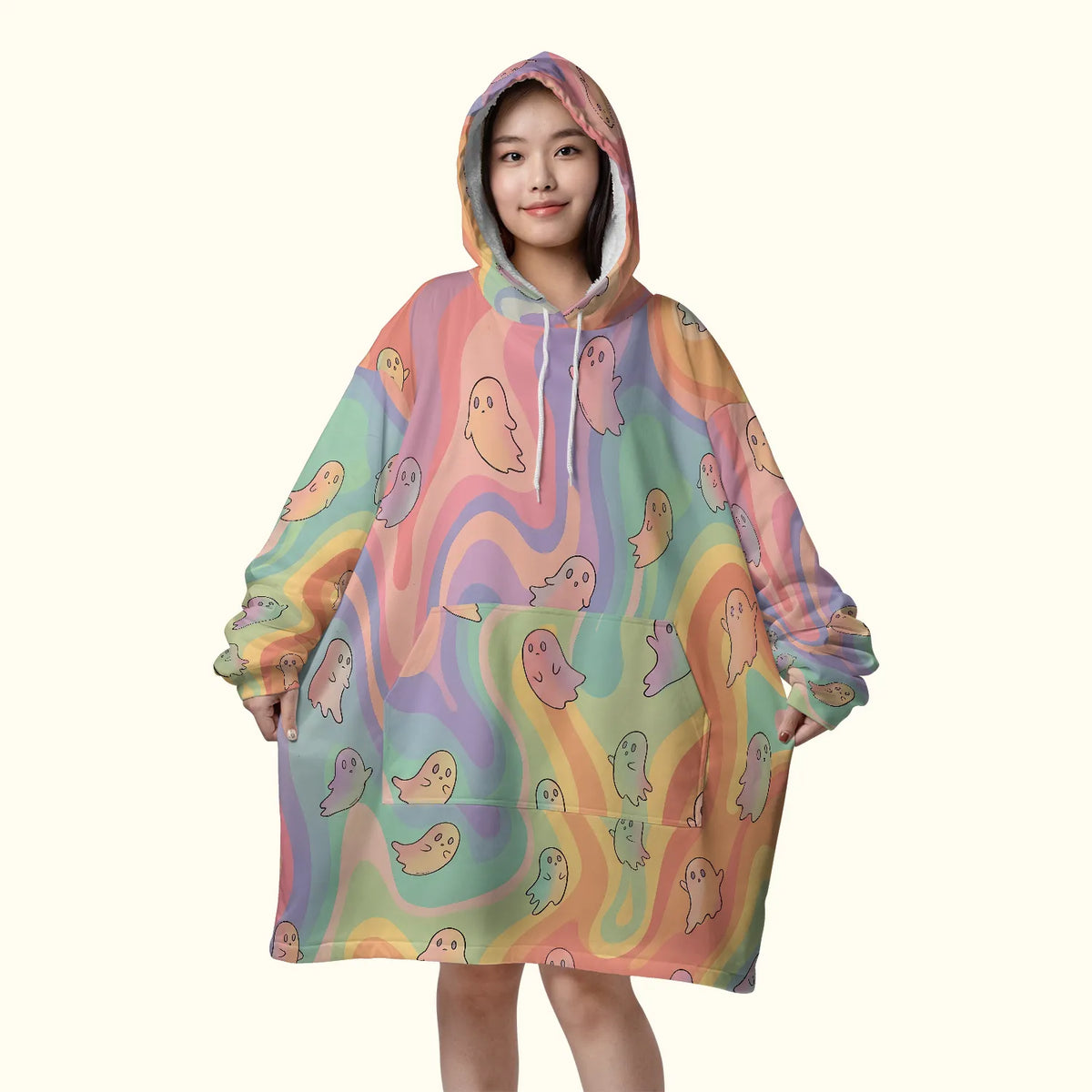 Front view of the Boo Blanket Hoodie Winter Rave Outfit, featuring an oversized pastel tie-dye ghost print, a deep front kangaroo pocket, and a warm sherpa-lined hood.