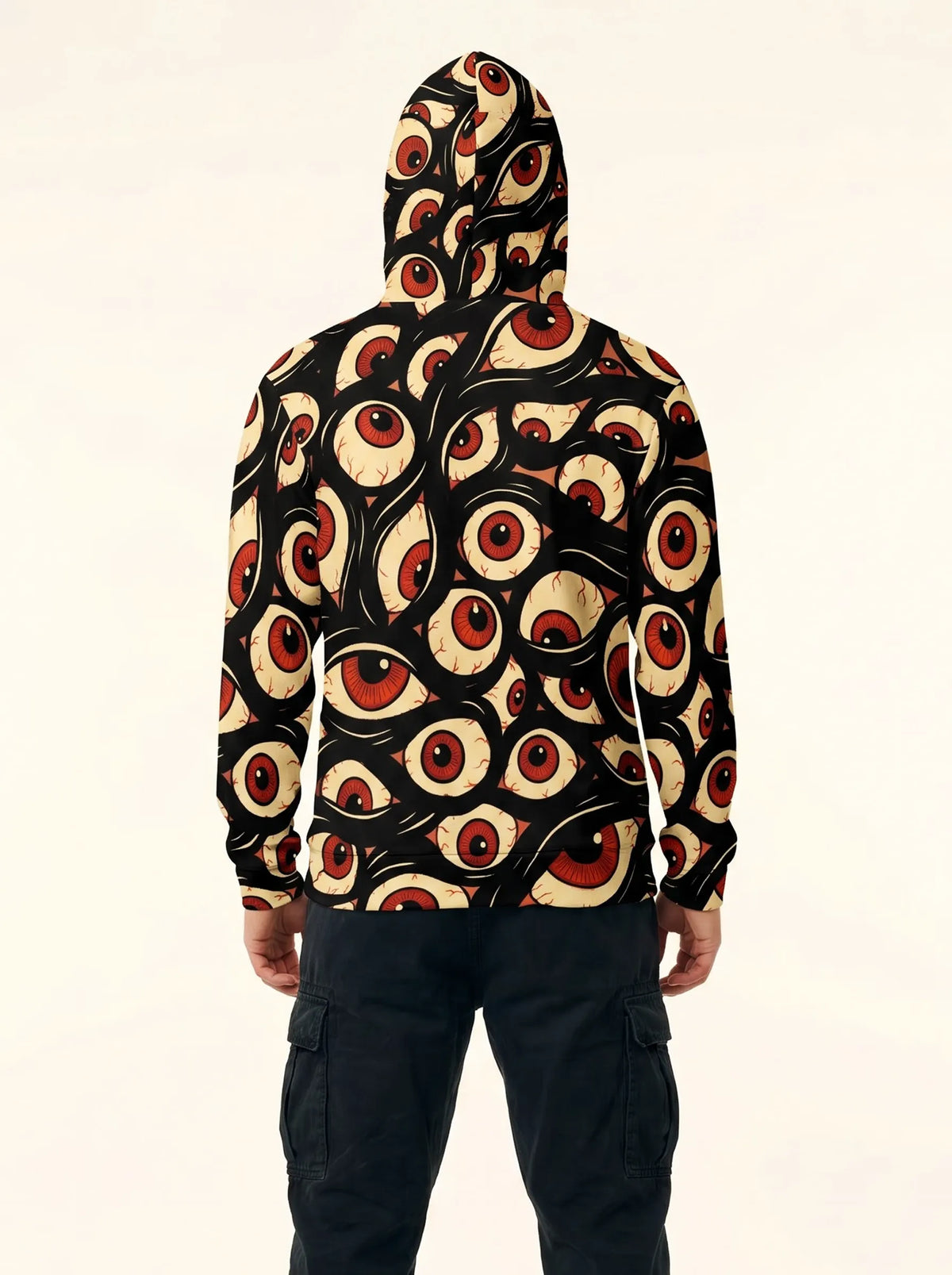 Back view of a man wearing the dark Halloween Hoodie Trippy Eye Rave Shirt, showcasing the all-over psychedelic eyeball pattern.