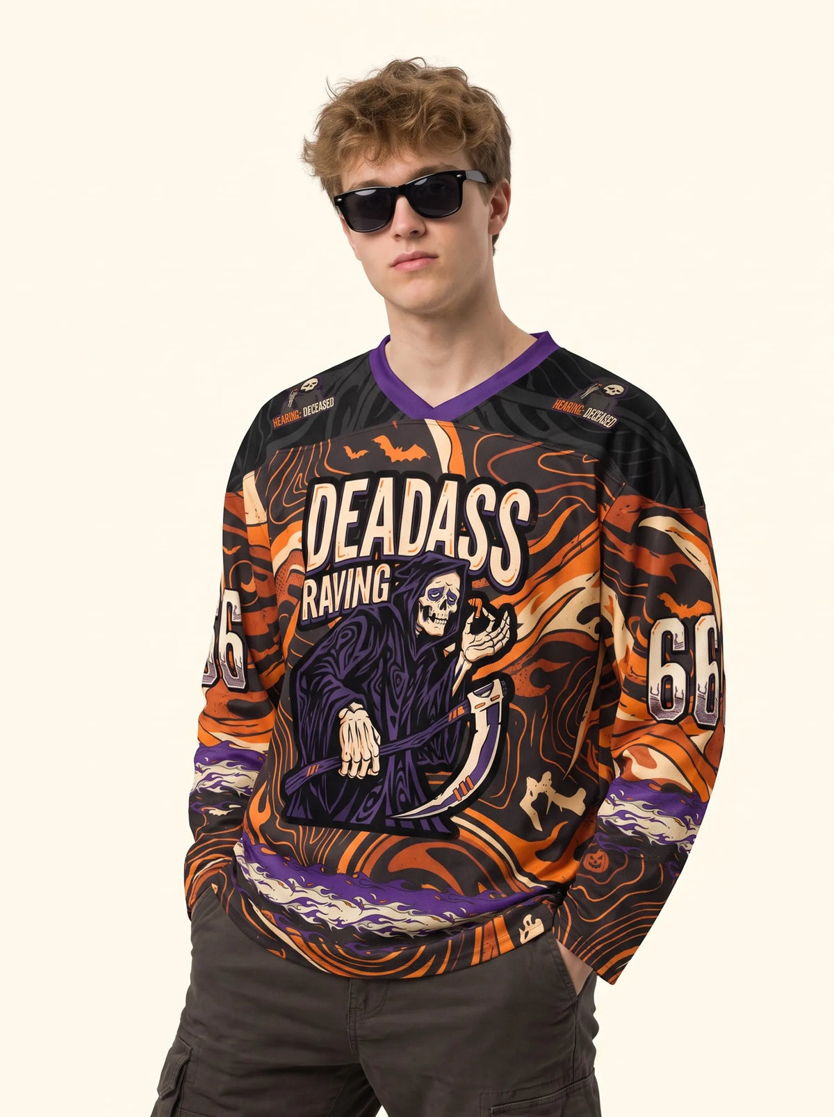 Man wearing the long sleeve Halloween rave hockey jersey Deadass Reaper styled with dark sunglasses.