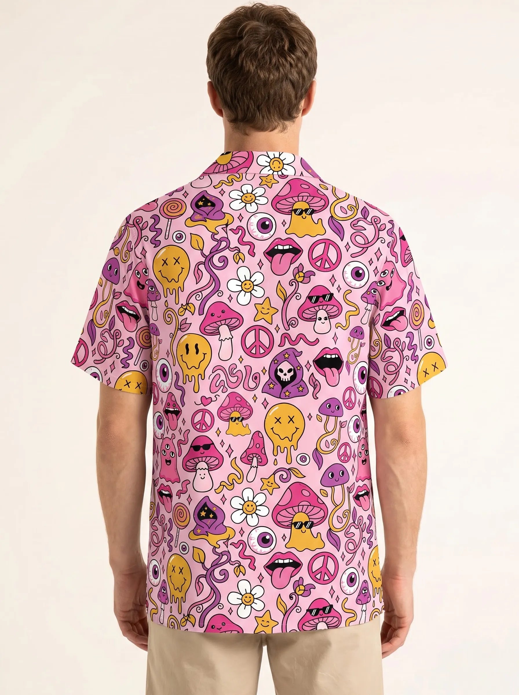 Back view of a man modeling a psychedelic pink Hawaiian shirt with bold 90s acid house graphics for electronic music events.