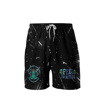 Front view of black mesh quick-dry rave shorts for men with a green alien graphic and white drawstring.