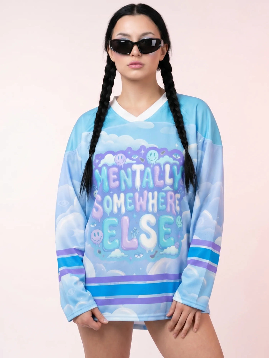 Female model wearing the pastel cloud rave hockey jersey, featuring a melting Mentally Somewhere Else graphic for an oversized trippy EDM outfit.