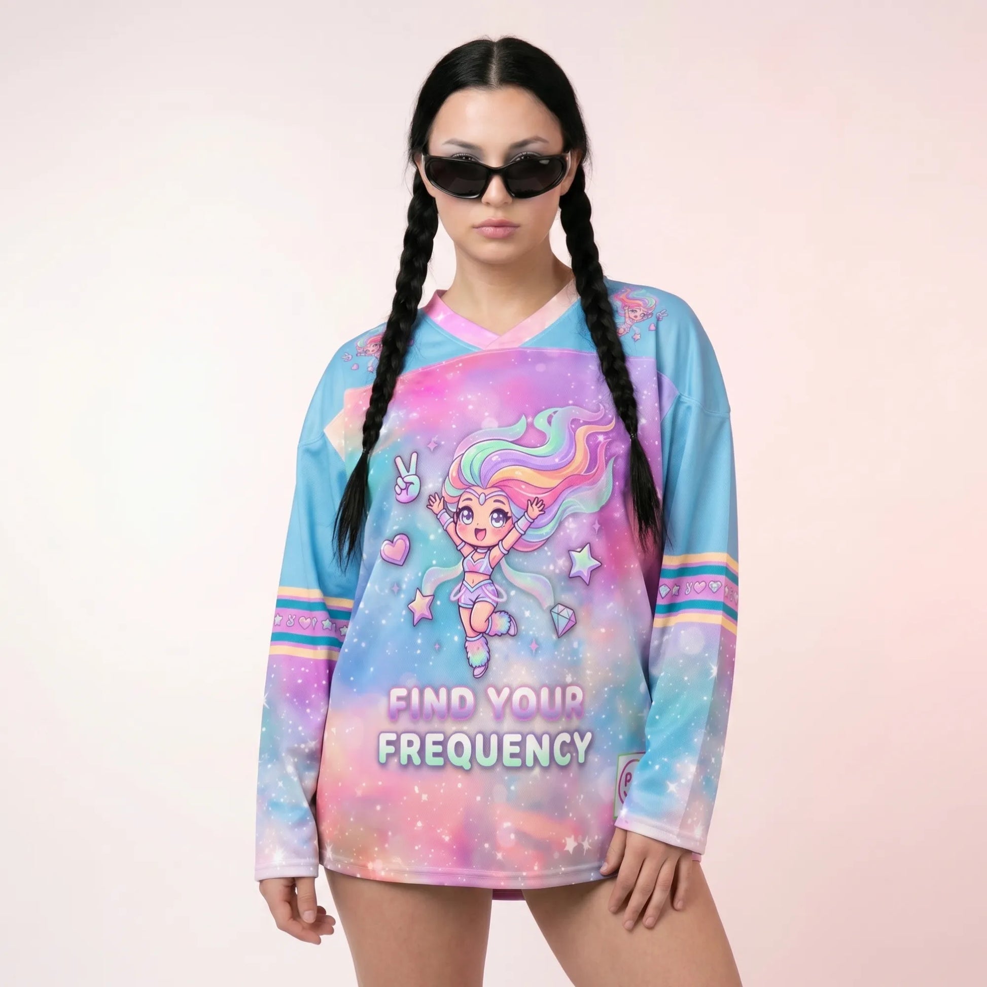 Woman modeling the Pastel-Galaxy-Rave-Hockey-Jersey-EDM-Top, which features a kawaii anime girl graphic and "Find Your Frequency" text over a pink and blue starry background.