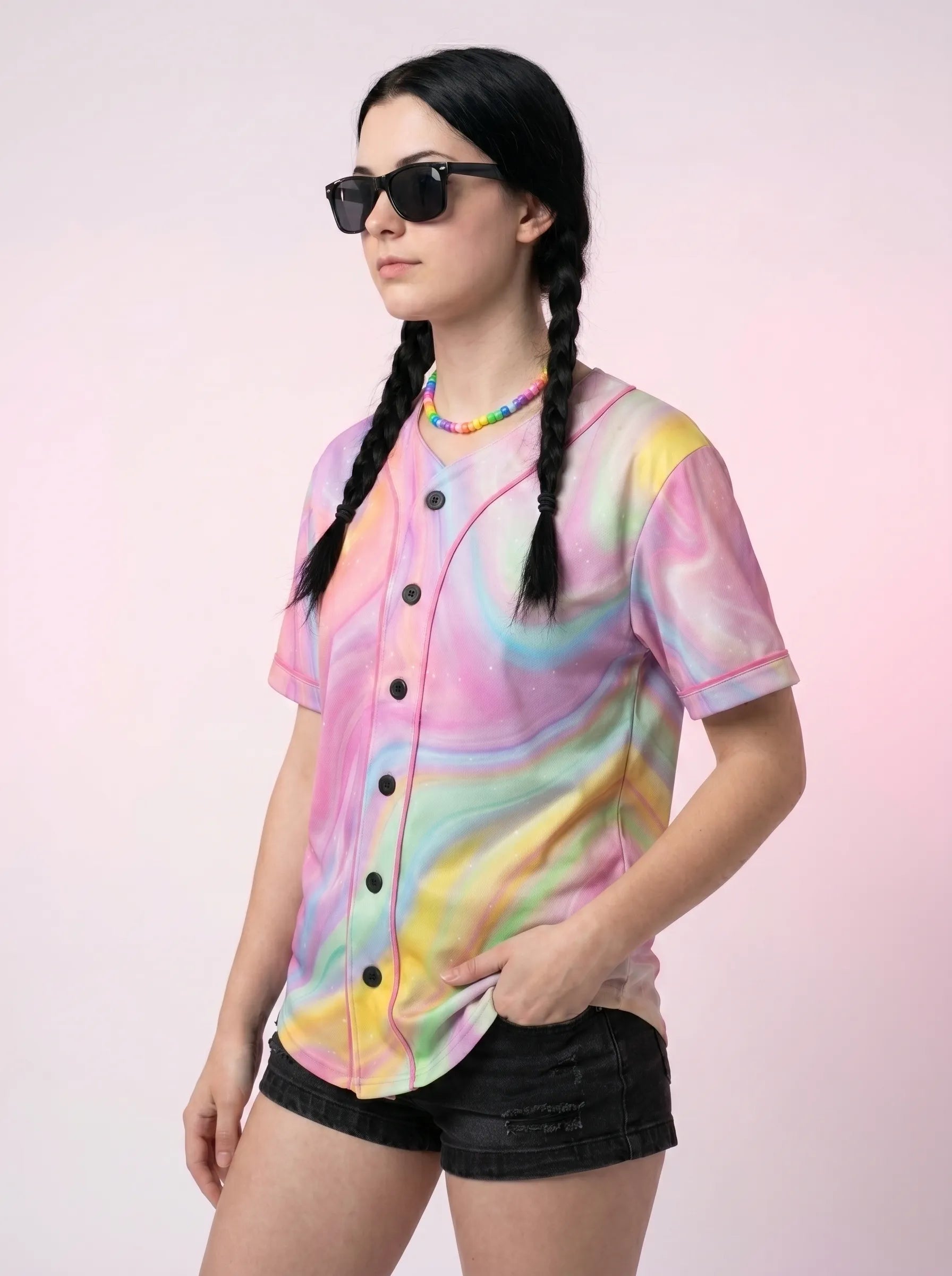 Angled view of a relaxed fit rave baseball jersey showcasing the trippy pastel marble design and pink piping.