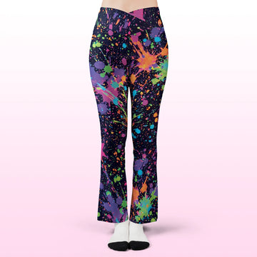 Front view of Rave Leggings Neon Paint Splatter Flare Festival Pants, featuring a crossover v-waistband and vibrant neon paint drips on a dark background