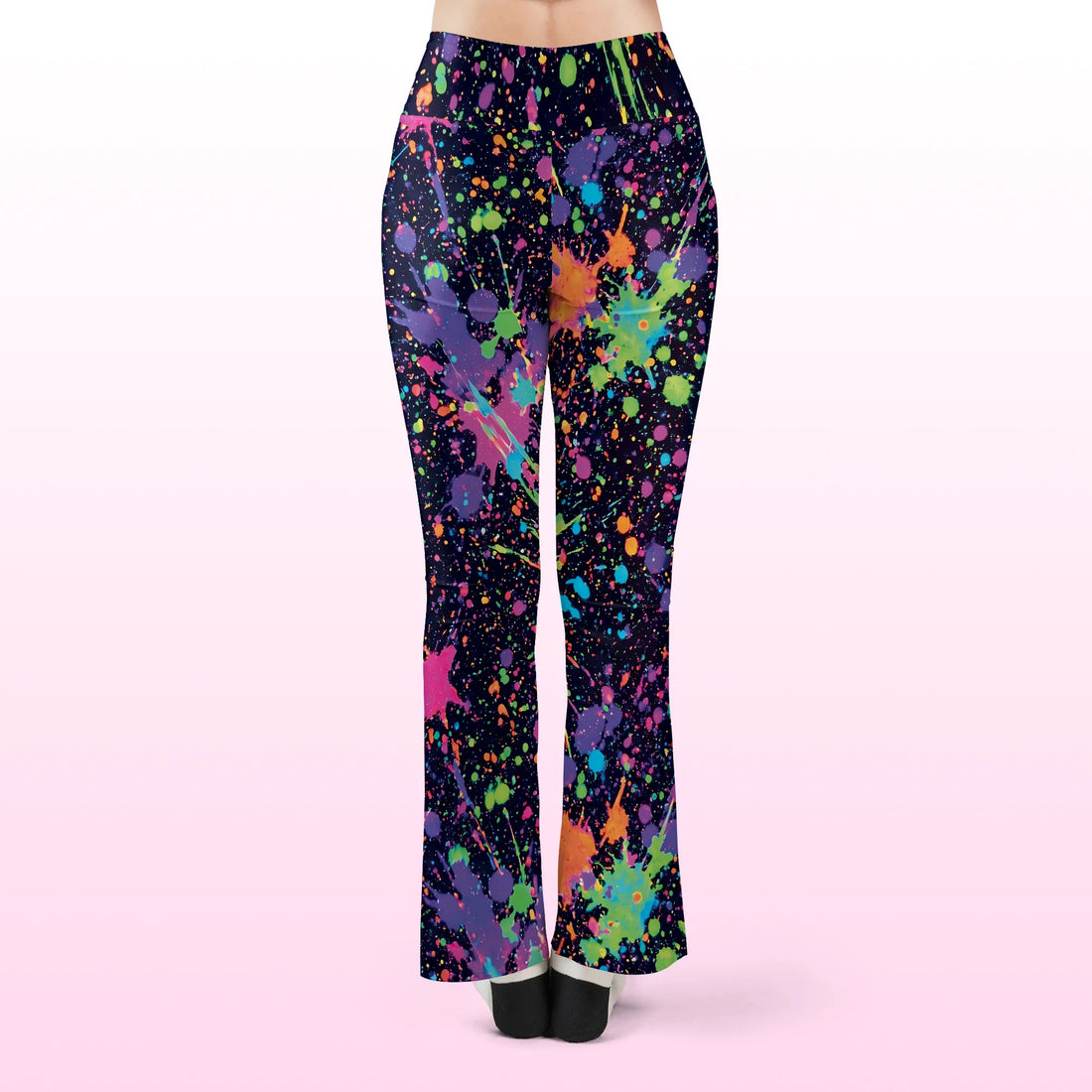 Front view of Rave Leggings Neon Paint Splatter Flare Festival Pants, featuring a crossover v-waistband and vibrant neon paint drips on a dark background
