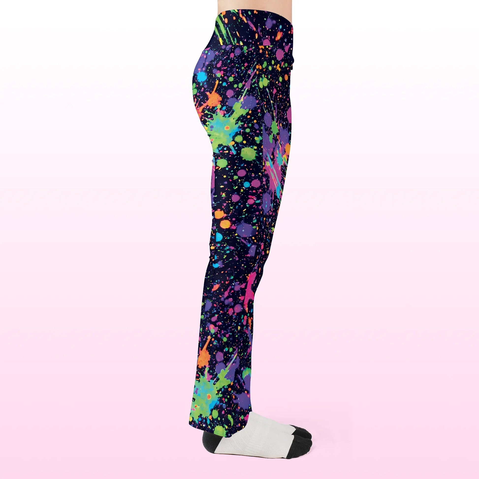 Right side profile of Rave Leggings Neon Paint Splatter Flare Festival Pants, highlighting the flared leg silhouette and bright trippy neon graphics