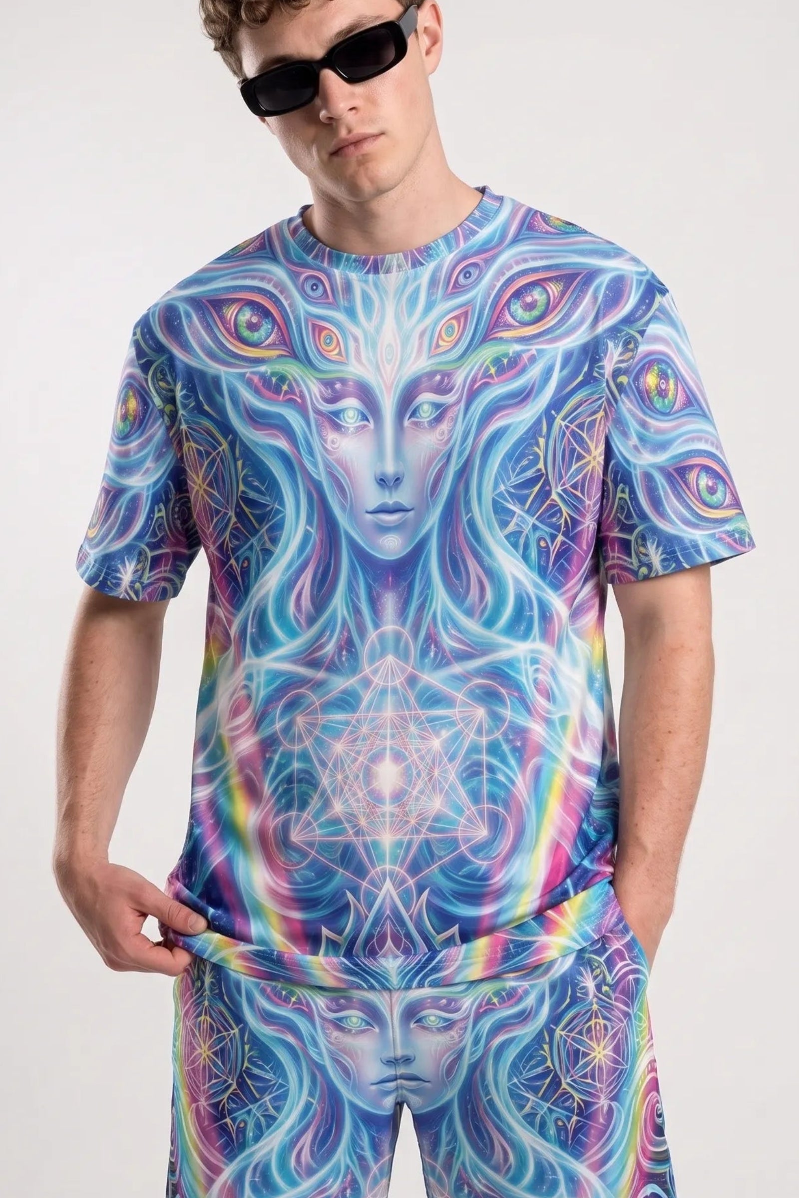 Guy wearing the front of a T Shirt Rave Trippy Festival Shirt paired with matching psychedelic shorts and black sunglasses.